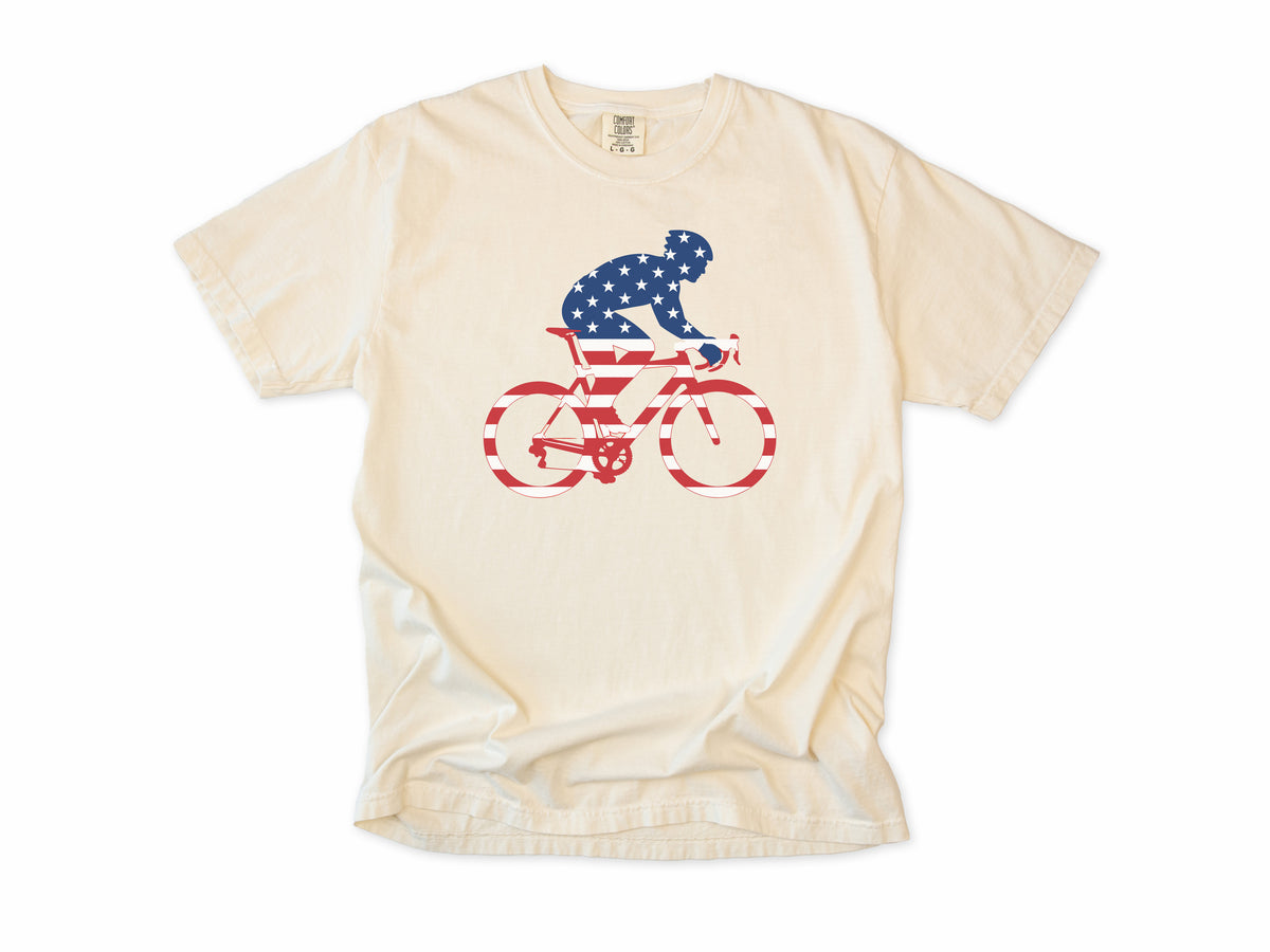 Cycling T-shirt in Ivory, a rider and bike filled with US flag stars and stripes, 4th of July gift for cyclists