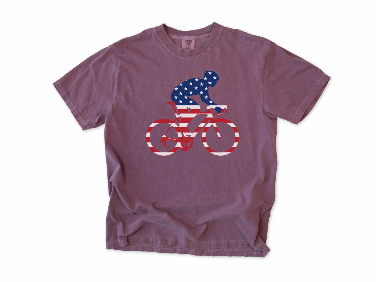 Cycling T-shirt in Berry, a rider and bike filled with US flag stars and stripes, 4th of July gift for cyclists