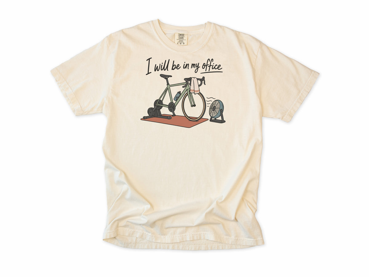 Funny cycling T-shirt in Ivory, 'I will be in my office' with a bike on a trainer and a fan, for indoor trainer riders