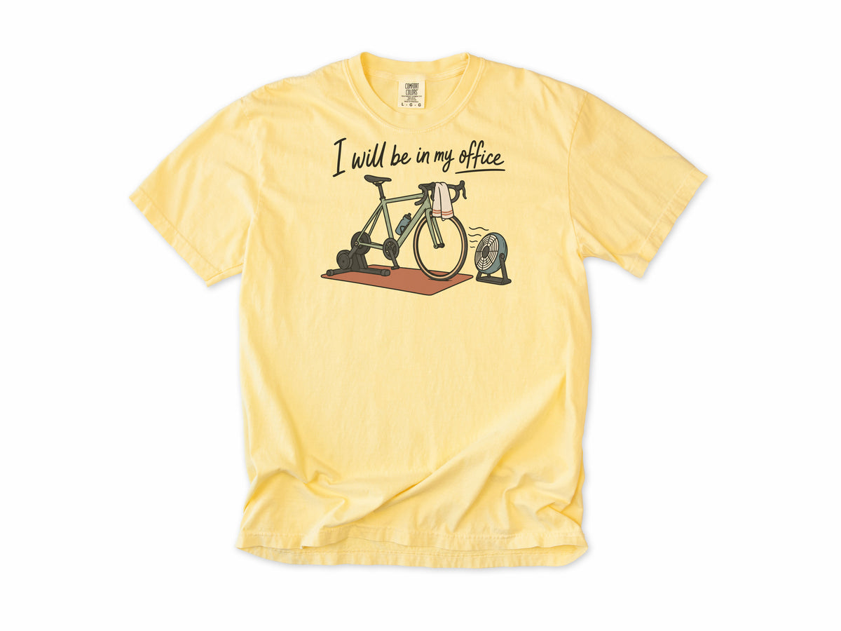 Funny cycling T-shirt in Butter, 'I will be in my office' with a bike on a trainer and a fan, for indoor trainer riders