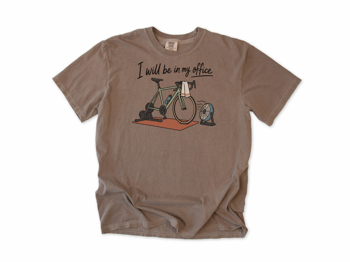 Funny cycling T-shirt in Espresso, 'I will be in my office' with a bike on a trainer and a fan, for indoor trainer riders