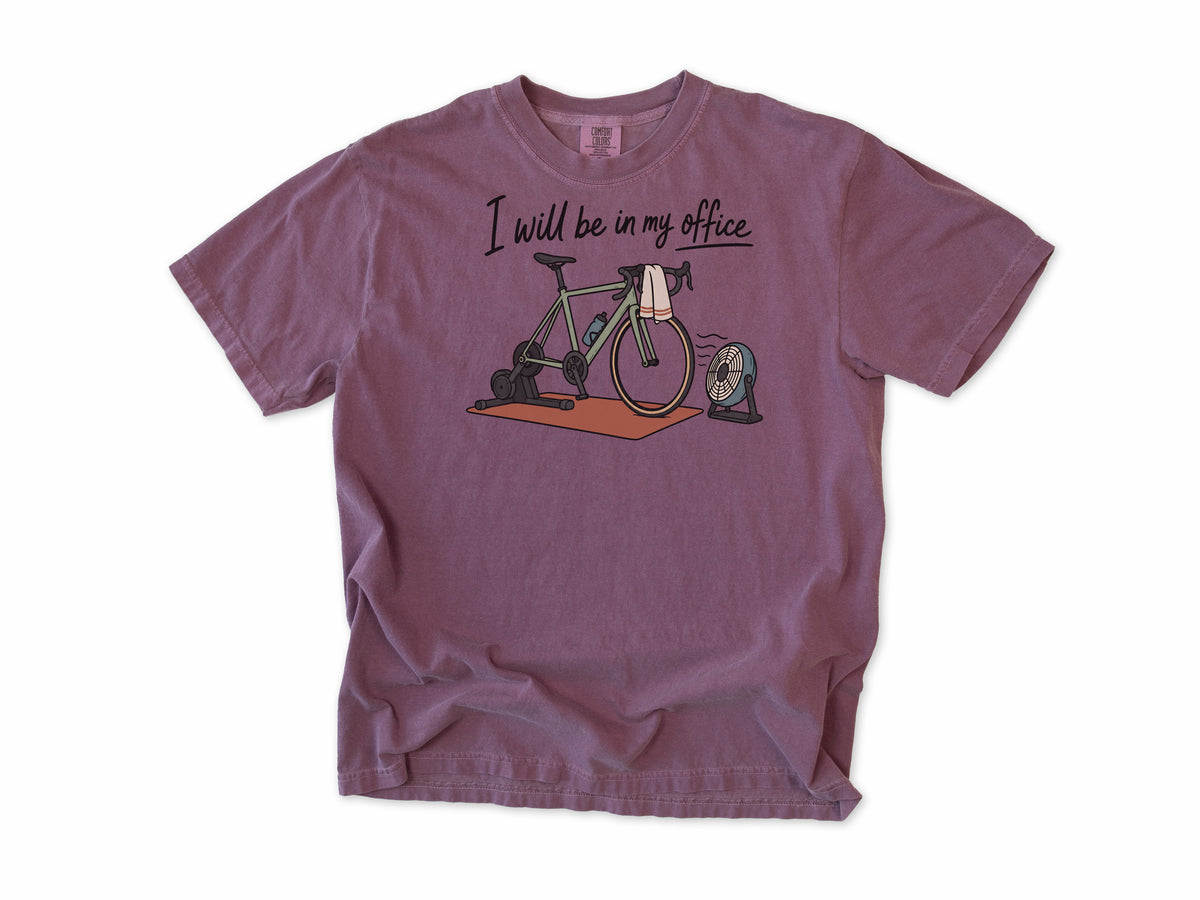 Funny cycling T-shirt in Berry, 'I will be in my office' with a bike on a trainer and a fan, for indoor trainer riders