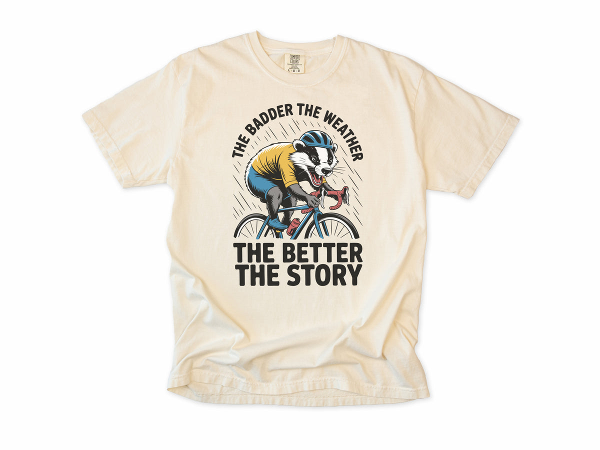 Funny cycling T-shirt in Ivory, a badger cycling, 'The badder the weather the better the story', for all-weather riders