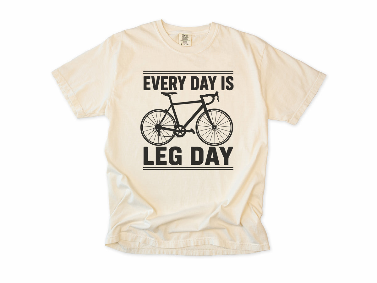 Cycling T-shirt in Ivory, 'Every Day Is Leg Day' with a road bike, for cyclists