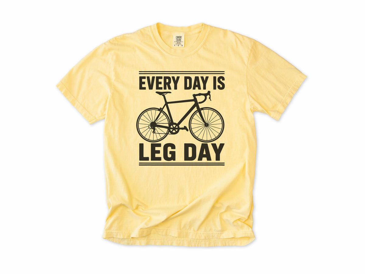 Cycling T-shirt in Butter, 'Every Day Is Leg Day' with a road bike, for cyclists
