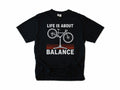 Funny cycling T-shirt in Black, 'Life Is About Balance' with a bike on a repair stand, for cyclists and bike mechanics