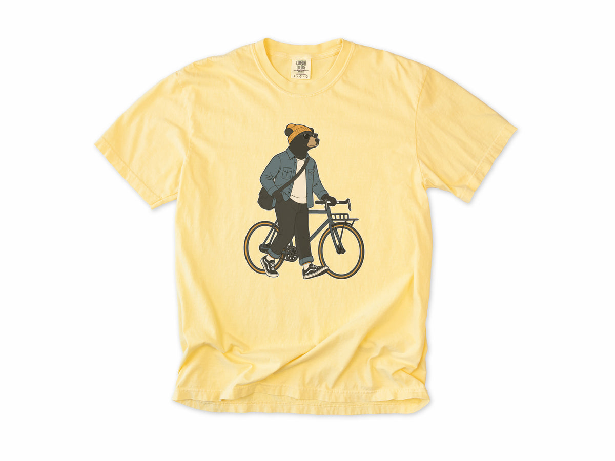 Funny cycling T-shirt in Butter, Casual Bear: a bear in a beanie and denim jacket walking a city bike, for relaxed everyday riders