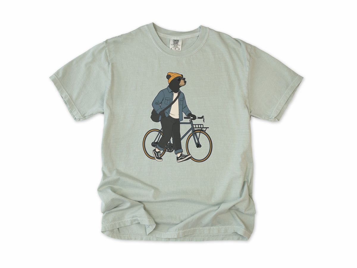 Funny cycling T-shirt in Bay, Casual Bear: a bear in a beanie and denim jacket walking a city bike, for relaxed everyday riders