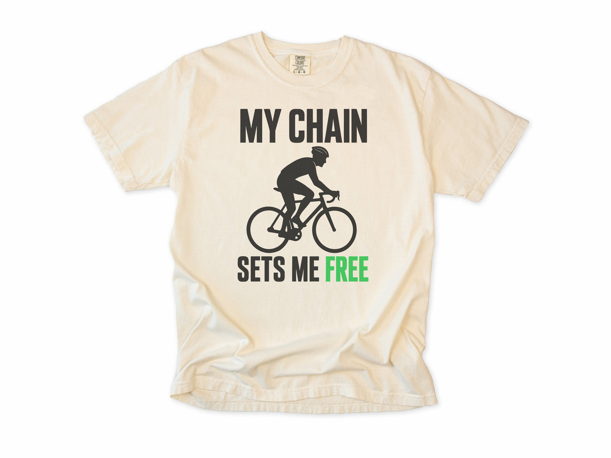 Funny cycling T-shirt in Ivory, 'My Chain Sets Me Free' with a cyclist silhouette, for cyclists