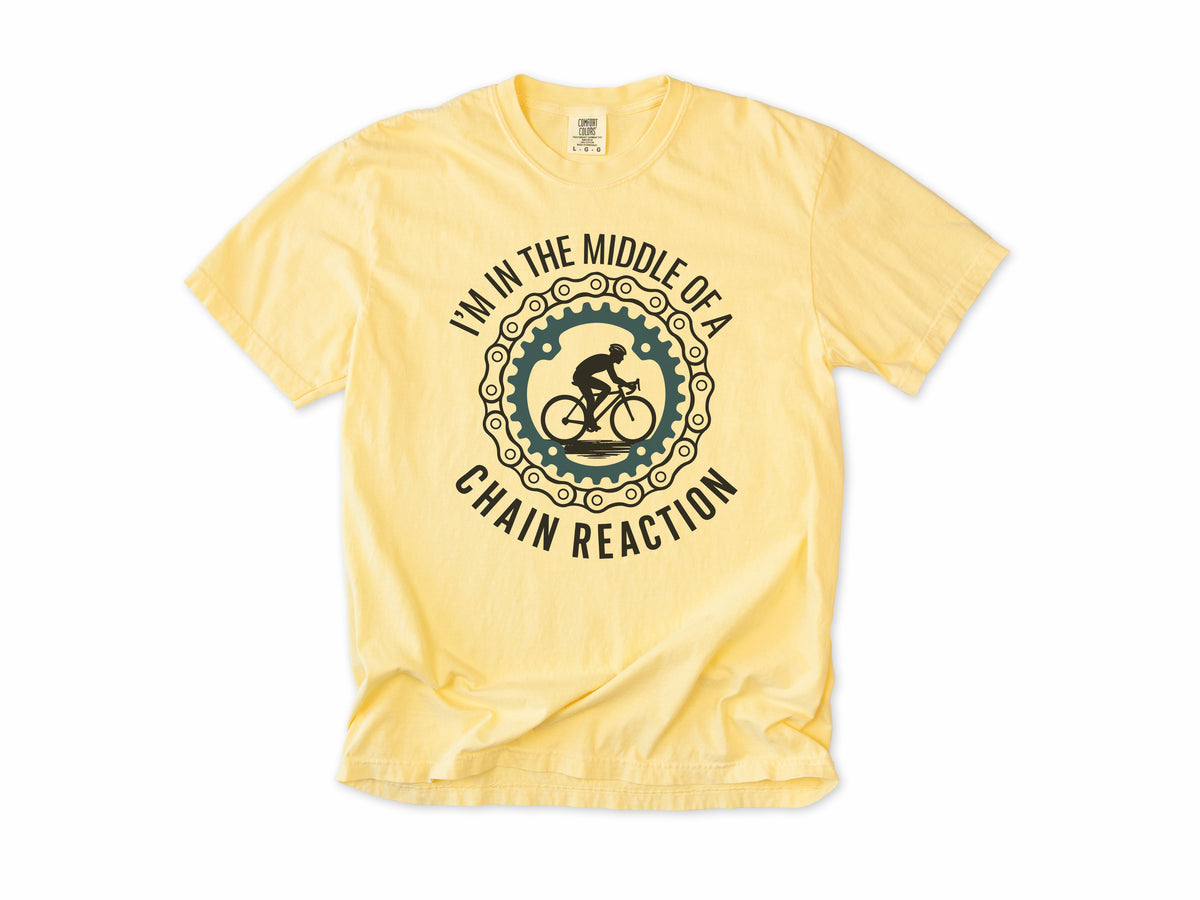 Funny cycling T-shirt in Butter, 'I'm in the middle of a chain reaction', a cyclist in a chainring, for road cyclists