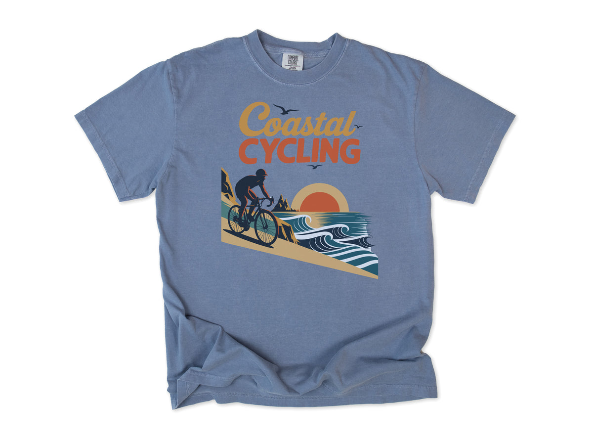 Cycling T-shirt in Blue Jean, 'Coastal Cycling', a cyclist by the sea at sunset, for cyclists who ride the coast