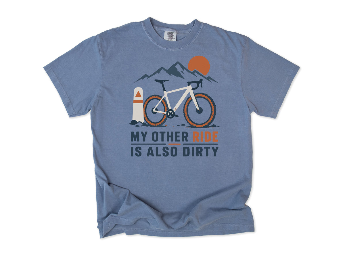 Funny cycling T-shirt in Blue Jean, 'My Other Ride Is Also Dirty' with a gravel bike, for gravel and mountain bikers