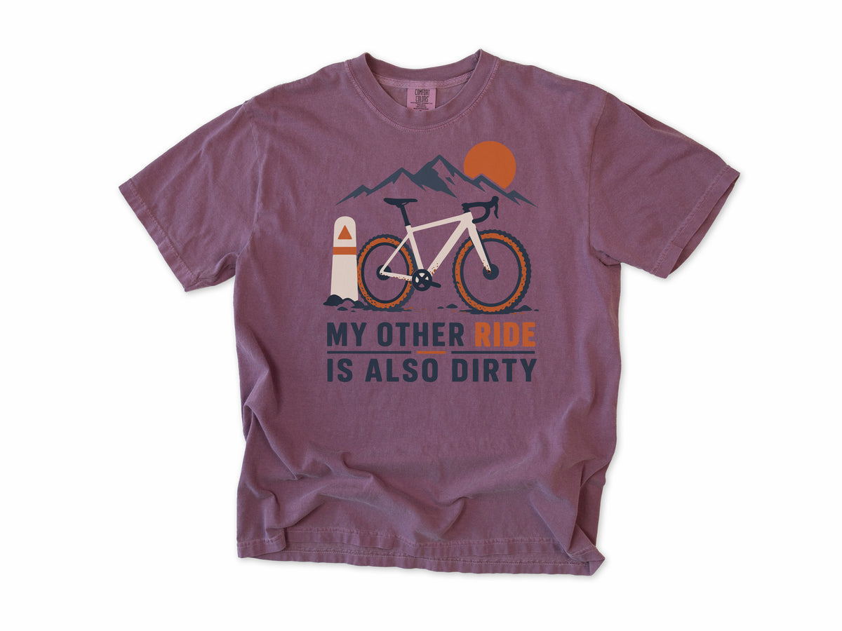Funny cycling T-shirt in Berry, 'My Other Ride Is Also Dirty' with a gravel bike, for gravel and mountain bikers