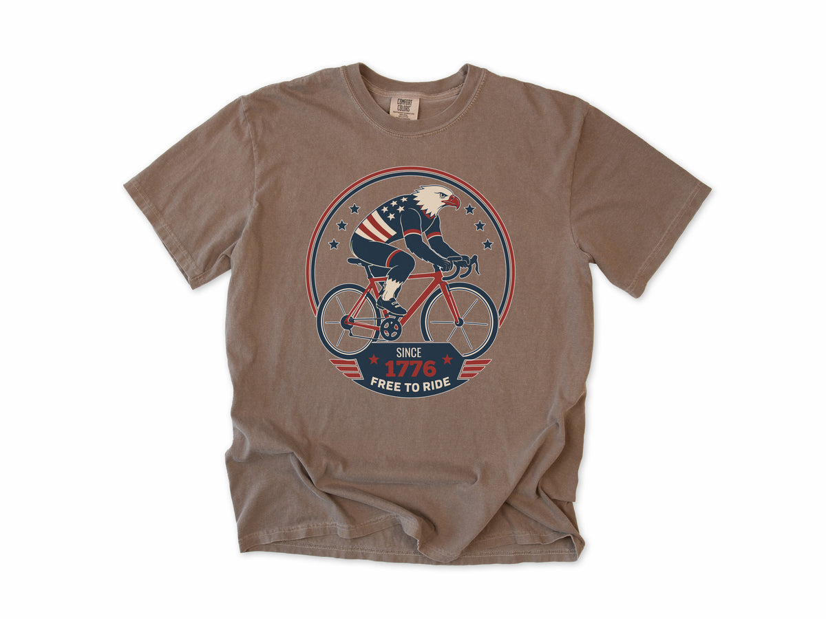Cycling T-shirt in Espresso, a bald eagle in stars and stripes riding a bike, America 250 and 4th of July gift for cyclists