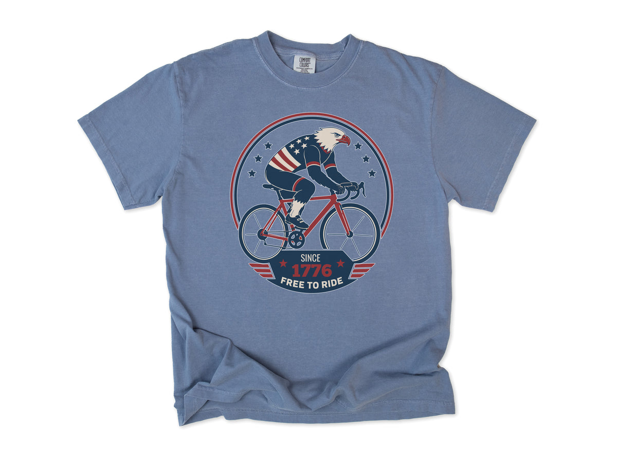 Cycling T-shirt in Blue Jean, a bald eagle in stars and stripes riding a bike, America 250 and 4th of July gift for cyclists