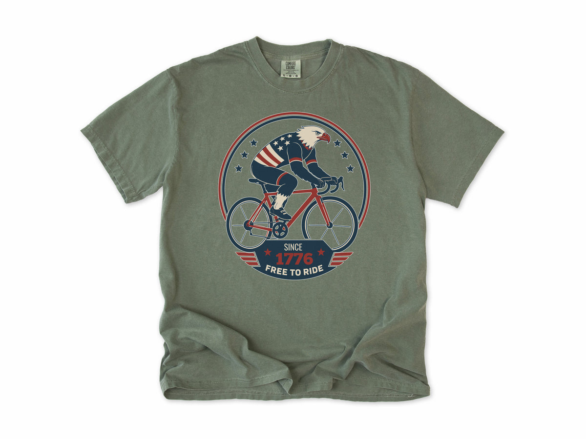 Cycling T-shirt in Moss, a bald eagle in stars and stripes riding a bike, America 250 and 4th of July gift for cyclists
