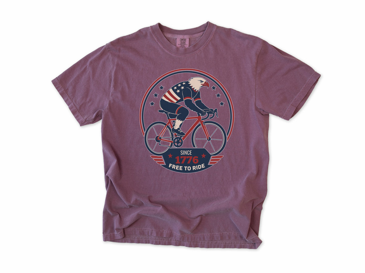 Cycling T-shirt in Berry, a bald eagle in stars and stripes riding a bike, America 250 and 4th of July gift for cyclists