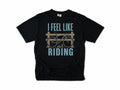 Cycling T-shirt in Black, 'I Feel Like Riding' with a bike on a wooden fence, for road and gravel cyclists