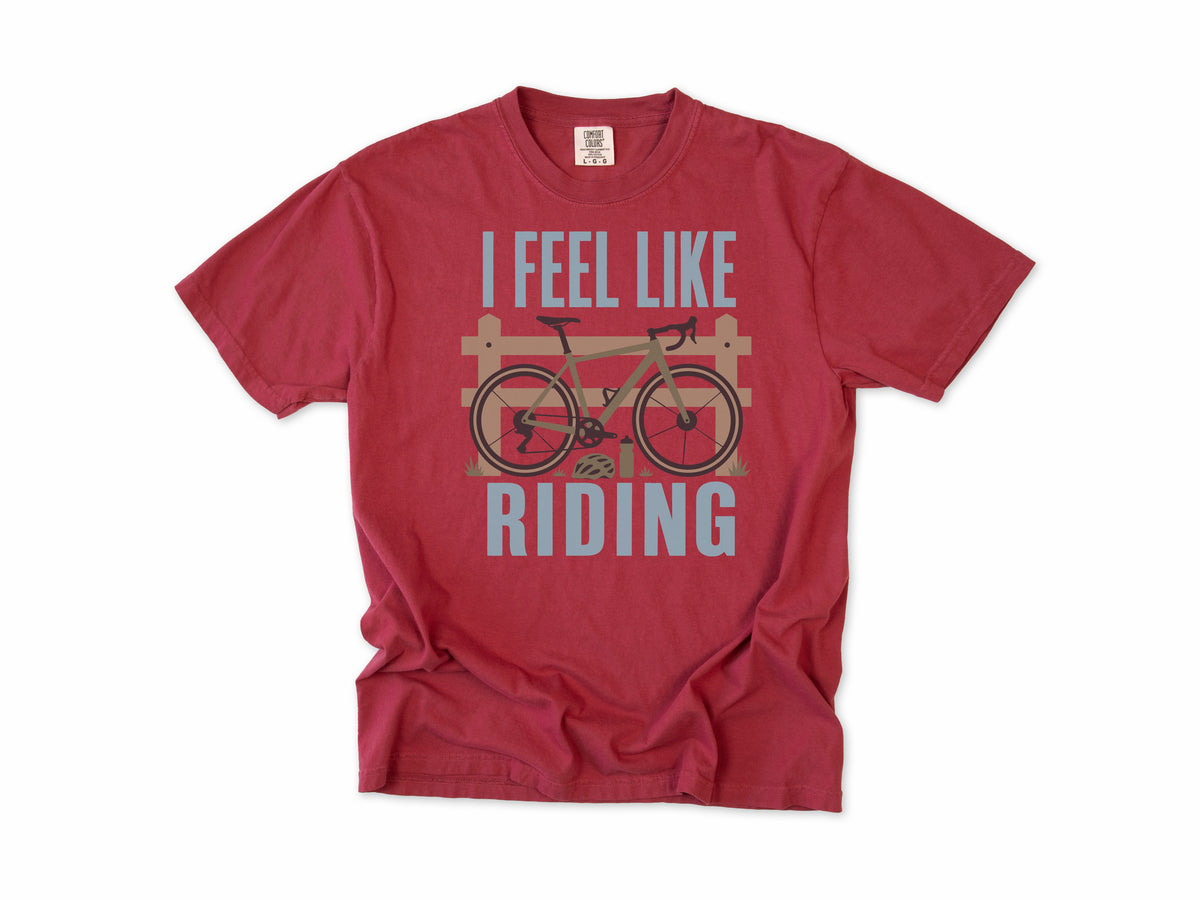 Cycling T-shirt in Chili, 'I Feel Like Riding' with a bike on a wooden fence, for road and gravel cyclists