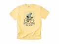 Funny cycling T-shirt in Butter, a cyclist in the rain, 'Forecast said sunshine. Rode anyway', for all-weather riders
