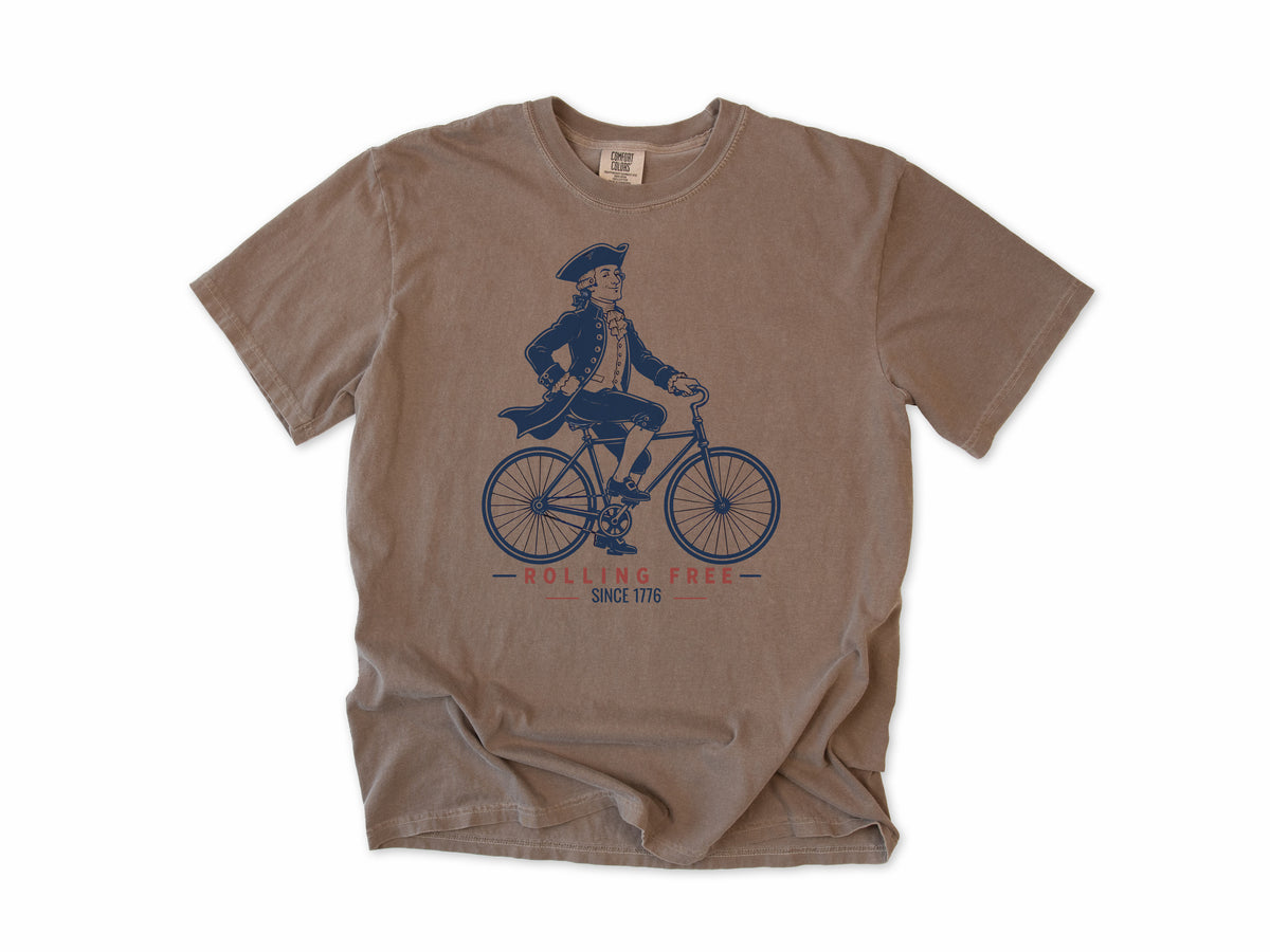 Cycling T-shirt in Espresso, Founding Father: a colonial gentleman in a tricorn hat riding a bike, America 250 and 4th of July gift for cyclists