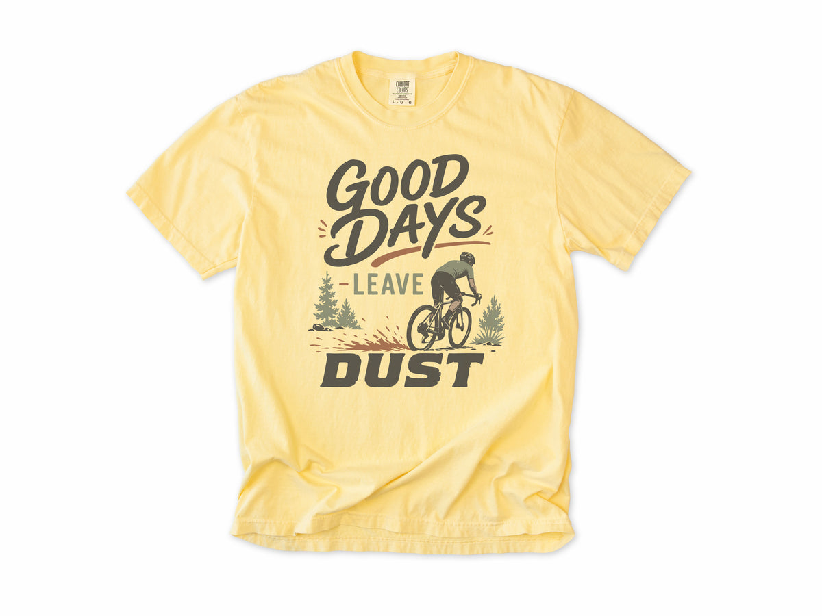 Cycling T-shirt in Butter, 'Good Days Leave Dust' with a cyclist on a dusty trail, for gravel riders