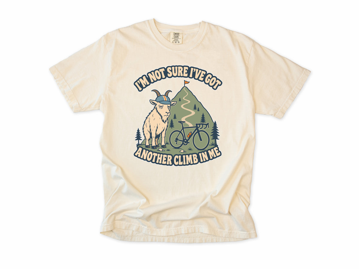 Funny cycling T-shirt in Ivory, a goat in a helmet with a bike, 'I'm not sure I've got another climb in me', for climbers