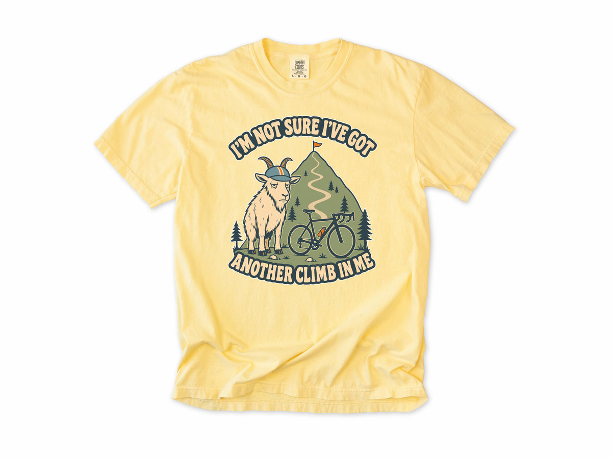 Funny cycling T-shirt in Butter, a goat in a helmet with a bike, 'I'm not sure I've got another climb in me', for climbers