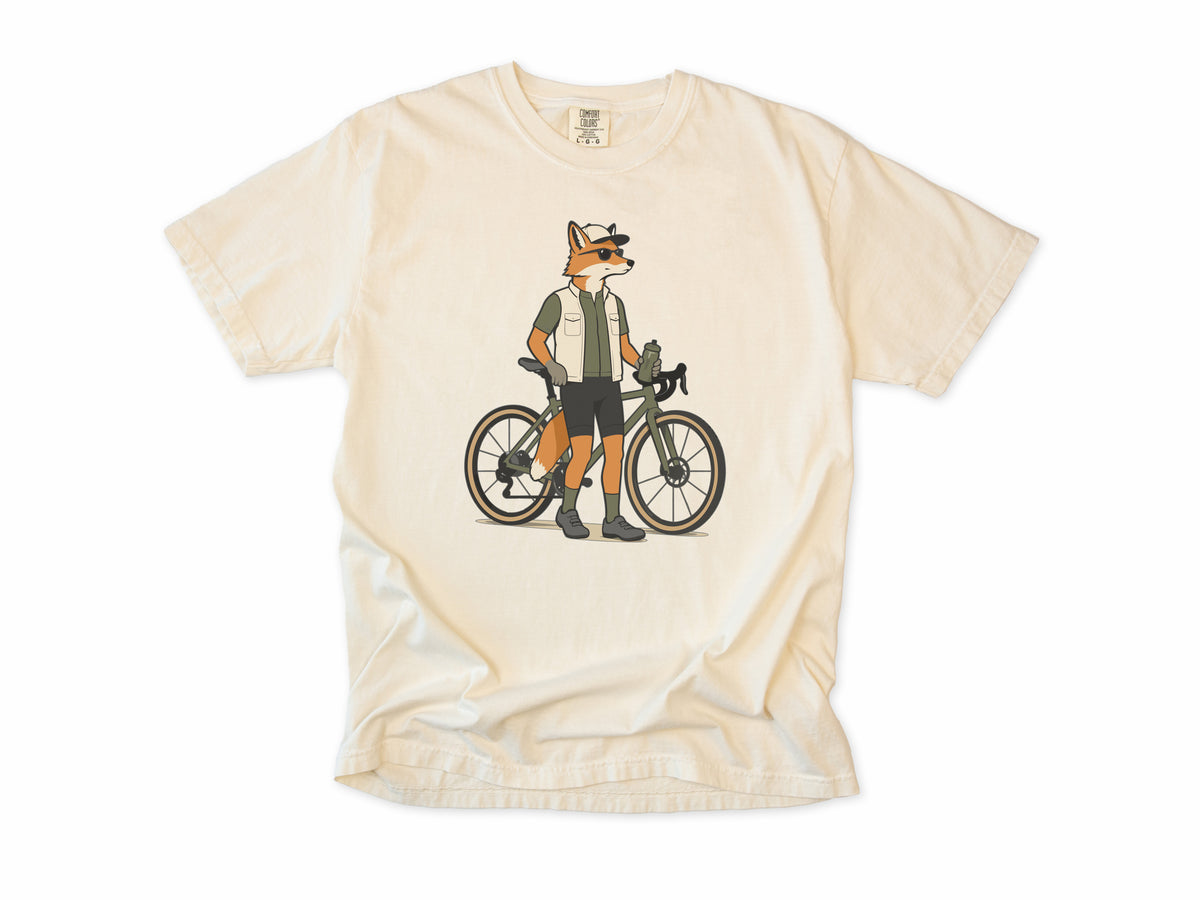Cycling T-shirt in Ivory, a fox in a vest and cap standing beside a gravel bike, for gravel riders