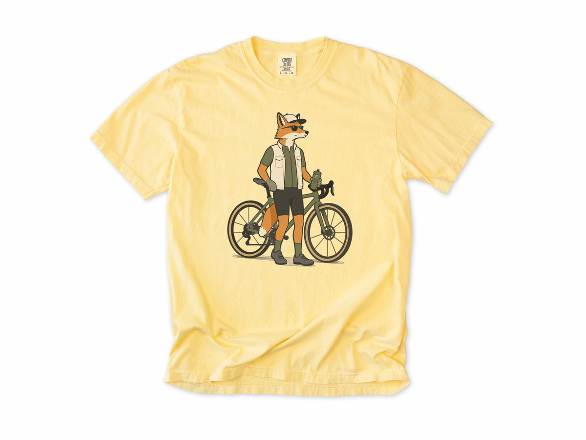 Cycling T-shirt in Butter, a fox in a vest and cap standing beside a gravel bike, for gravel riders