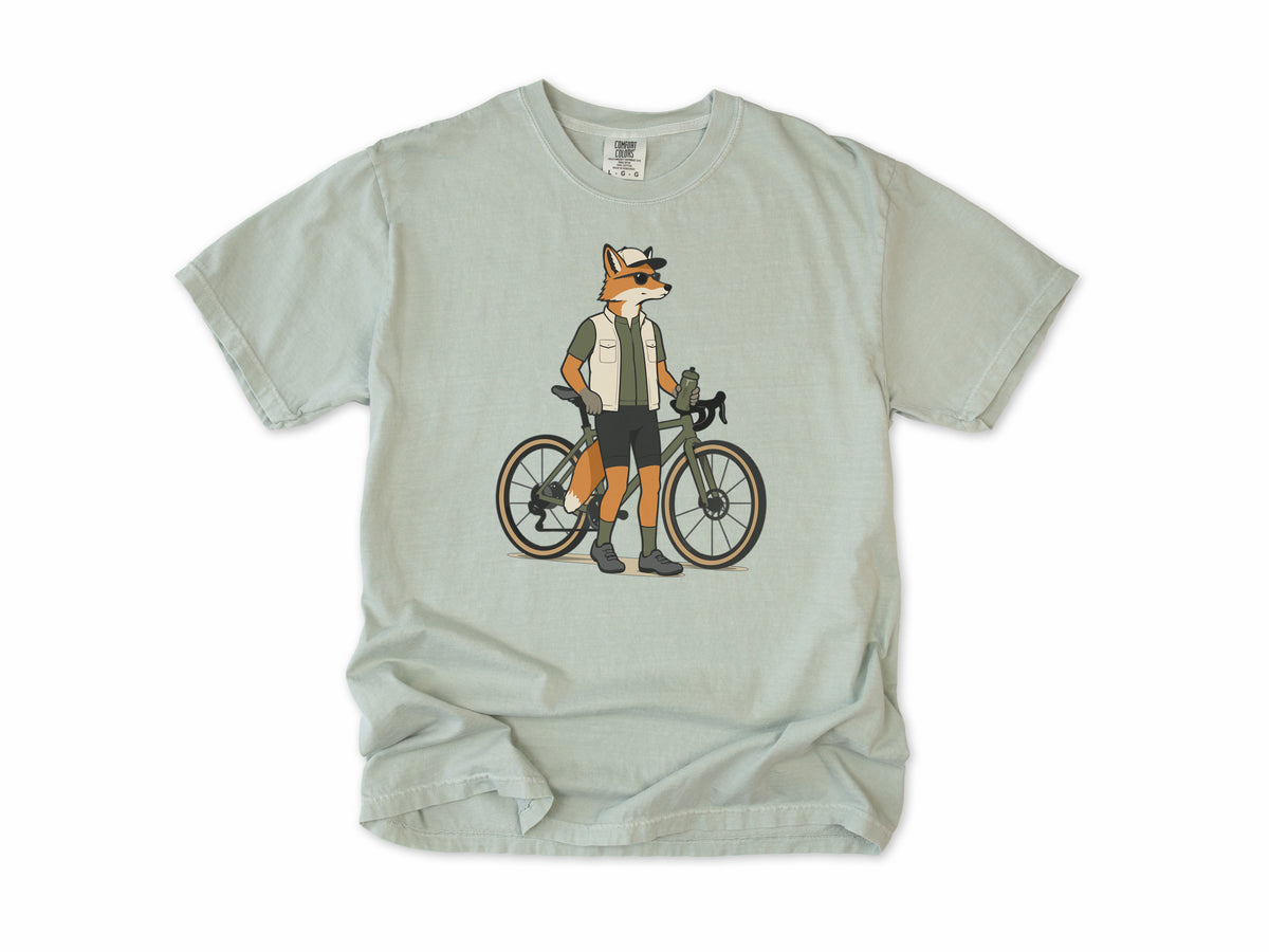 Cycling T-shirt in Bay, a fox in a vest and cap standing beside a gravel bike, for gravel riders
