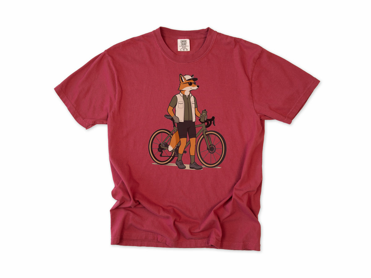 Cycling T-shirt in Chili, a fox in a vest and cap standing beside a gravel bike, for gravel riders
