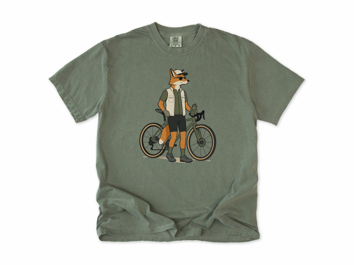 Cycling T-shirt in Moss, a fox in a vest and cap standing beside a gravel bike, for gravel riders