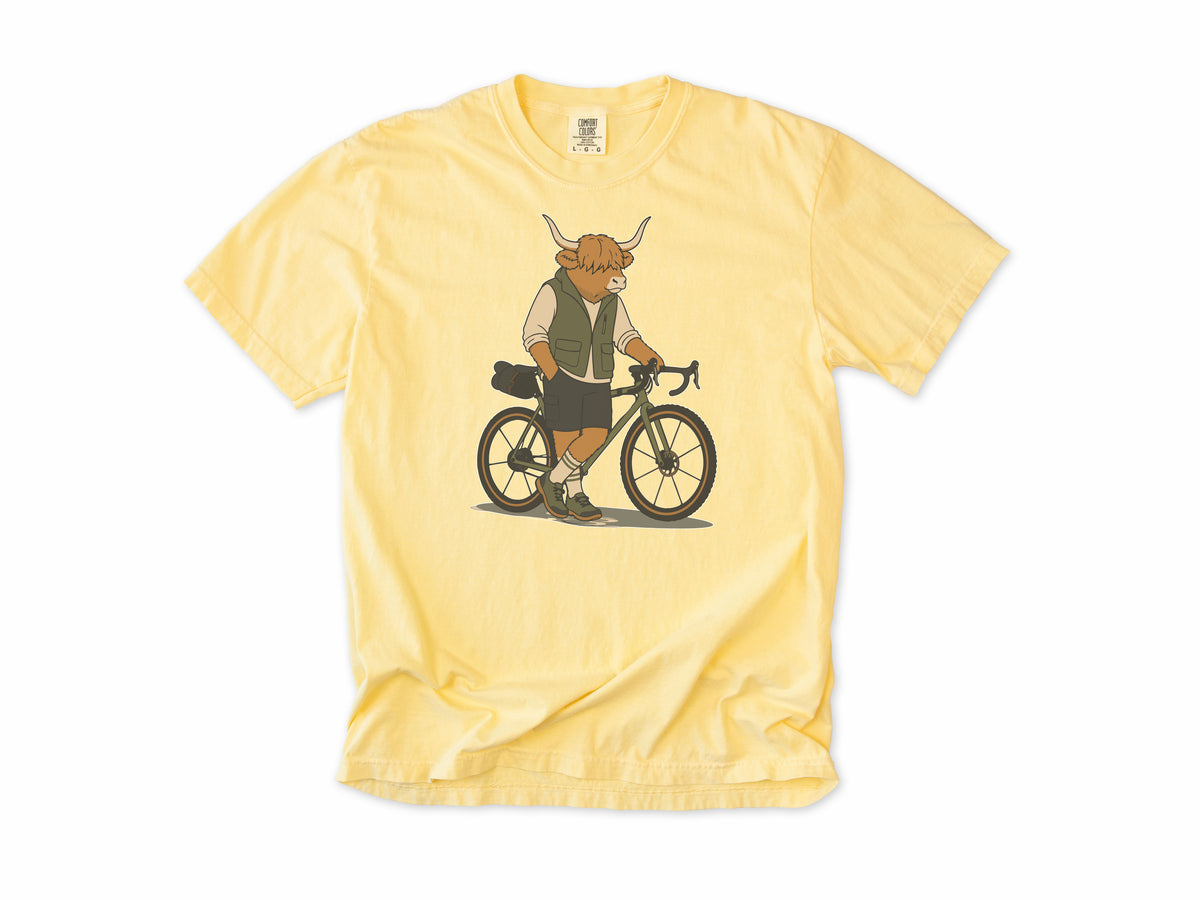 Cycling T-shirt in Butter, a Highland cow in a vest standing beside a gravel bike, for gravel riders