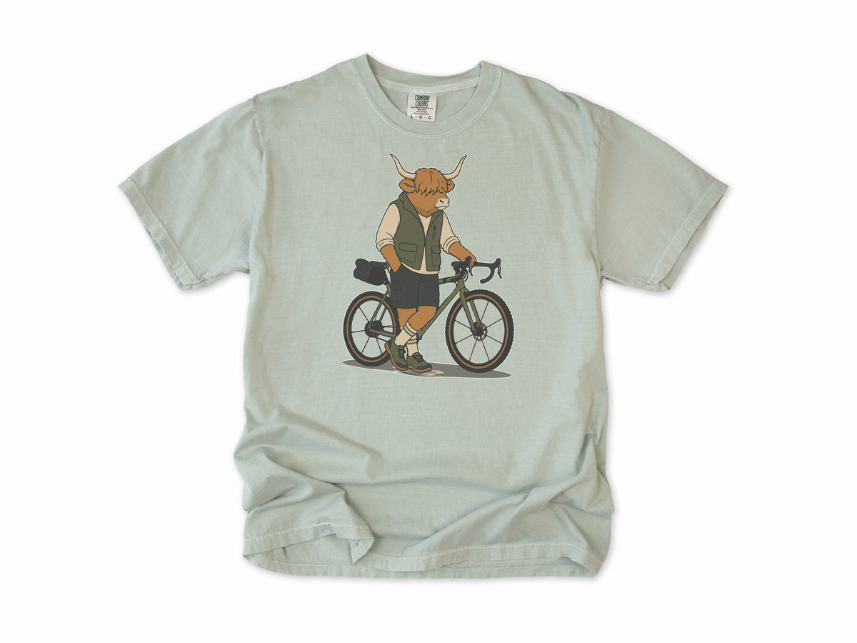 Cycling T-shirt in Bay, a Highland cow in a vest standing beside a gravel bike, for gravel riders
