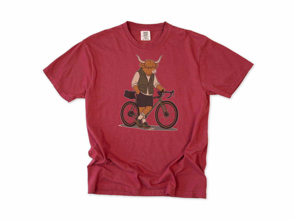 Cycling T-shirt in Chili, a Highland cow in a vest standing beside a gravel bike, for gravel riders