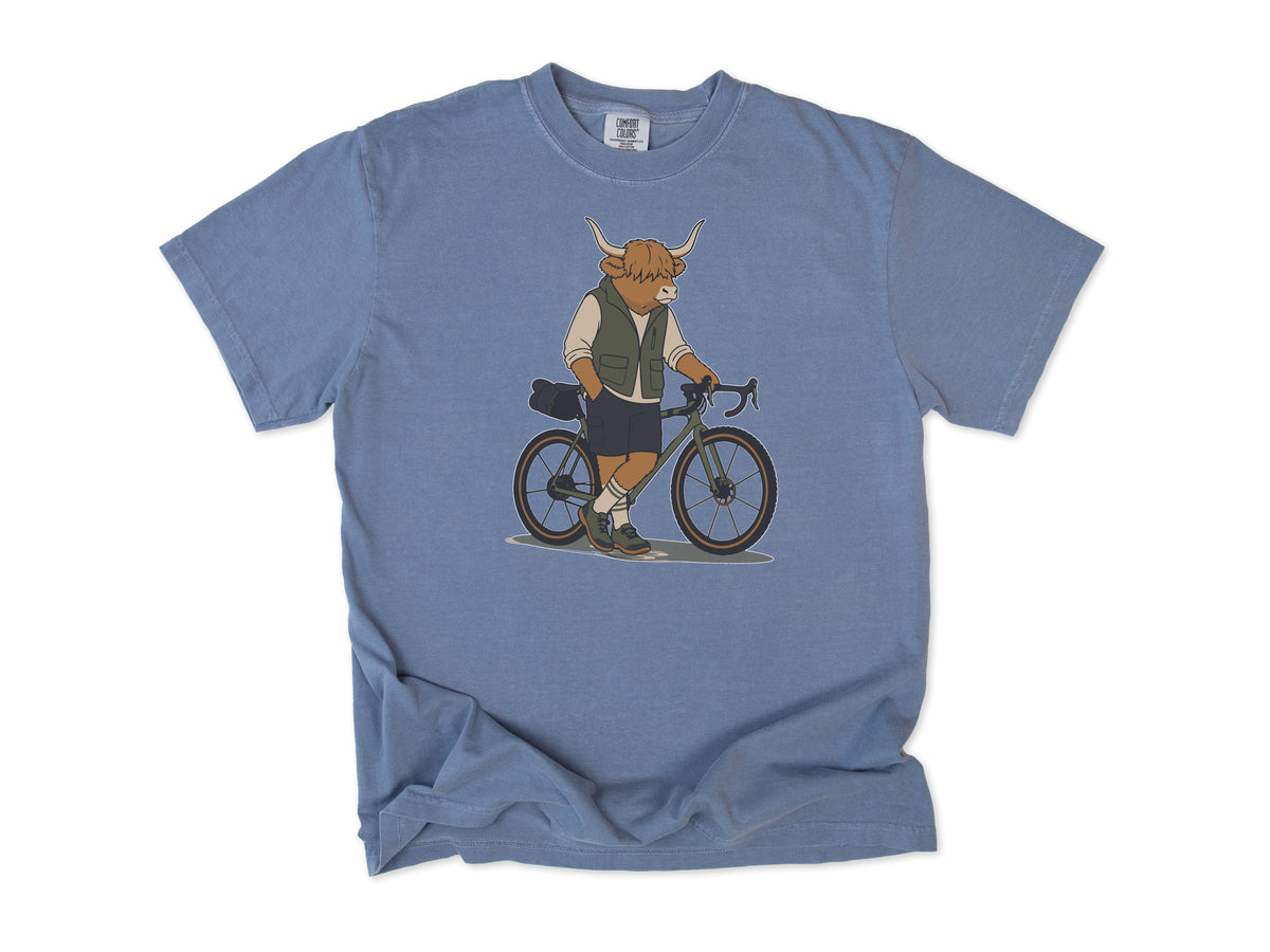 Cycling T-shirt in Blue Jean, a Highland cow in a vest standing beside a gravel bike, for gravel riders
