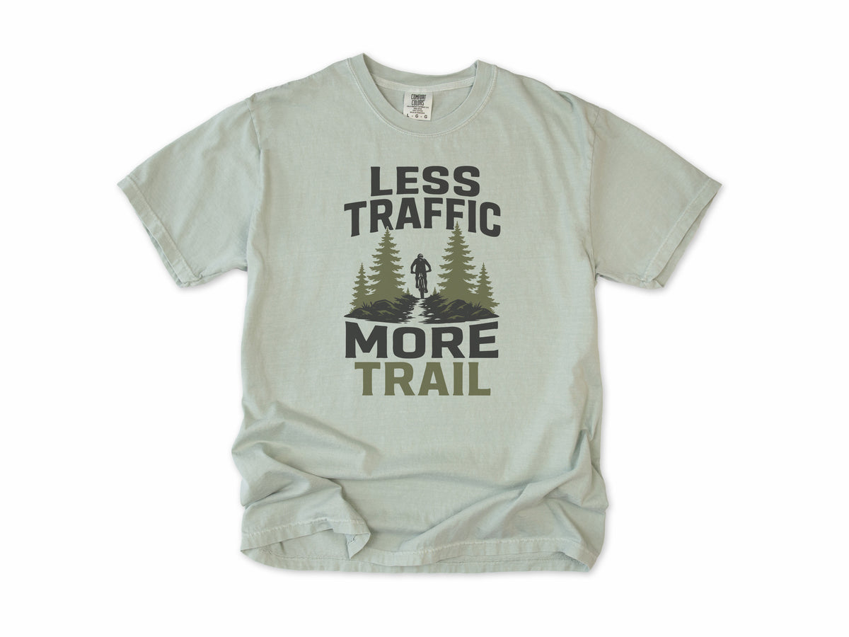 Cycling T-shirt in Bay, 'Less Traffic More Trail' with a rider between pine trees, for mountain bikers