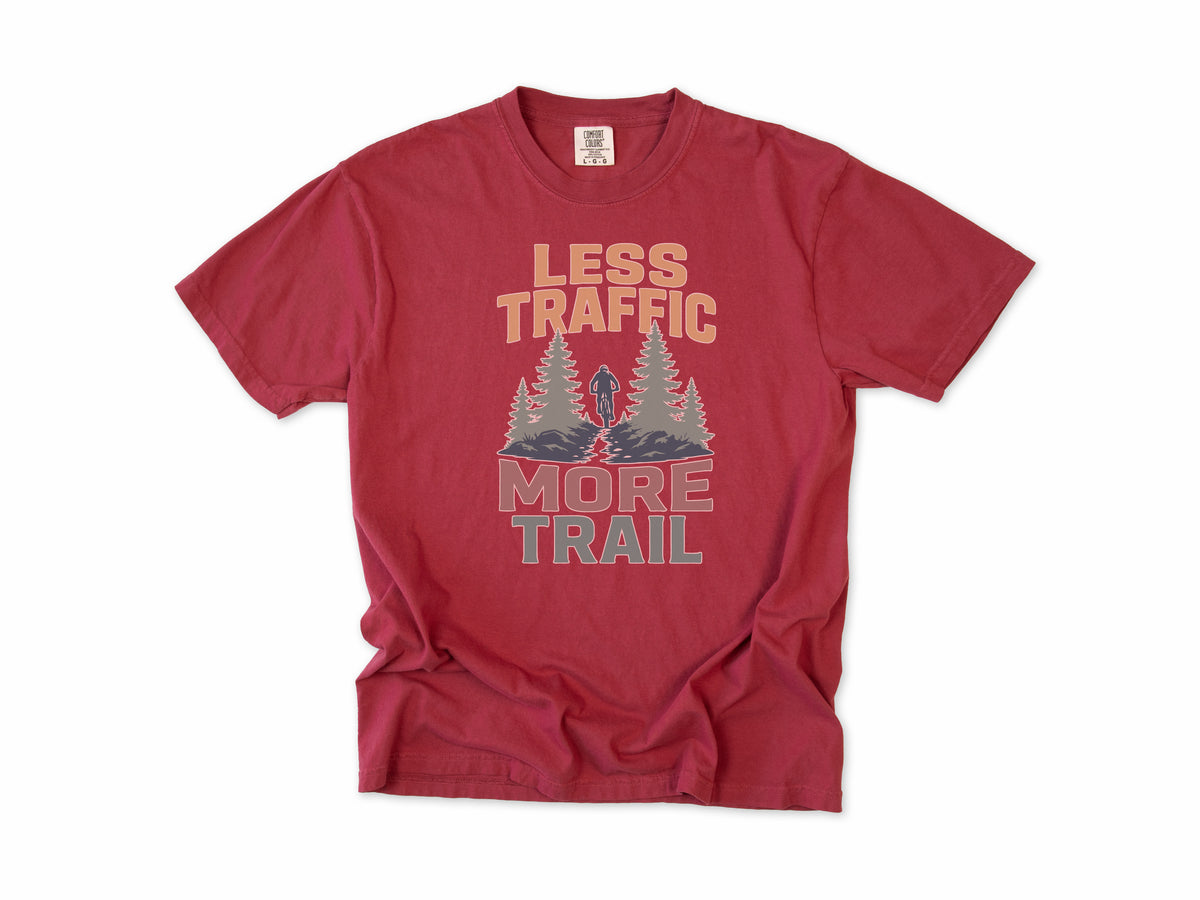 Cycling T-shirt in Chili, 'Less Traffic More Trail' with a rider between pine trees, for mountain bikers