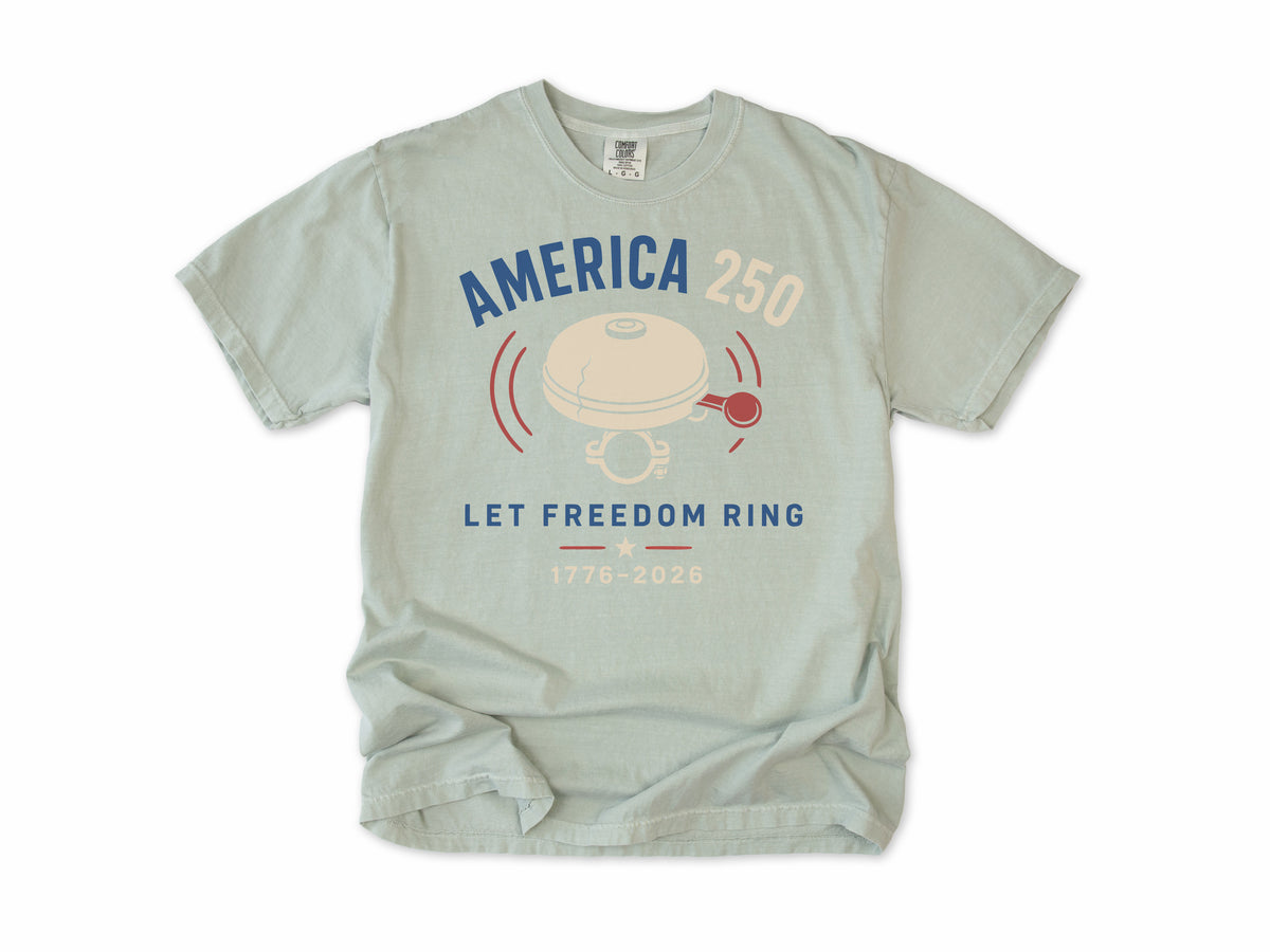 Cycling T-shirt in Bay, a bike bell with 'Let Freedom Ring', America 250 and 4th of July gift for cyclists
