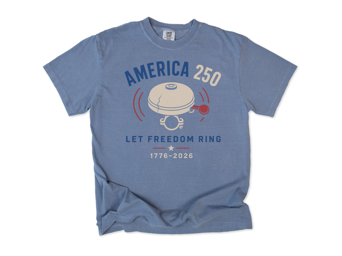 Cycling T-shirt in Blue Jean, a bike bell with 'Let Freedom Ring', America 250 and 4th of July gift for cyclists