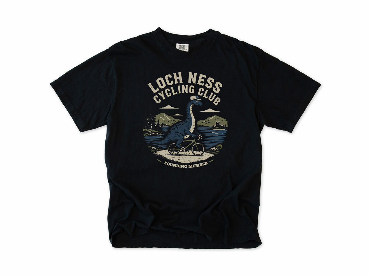 Cycling T-shirt in Black, 'Loch Ness Cycling Club', a monster riding a bike by a loch, for cycling club members