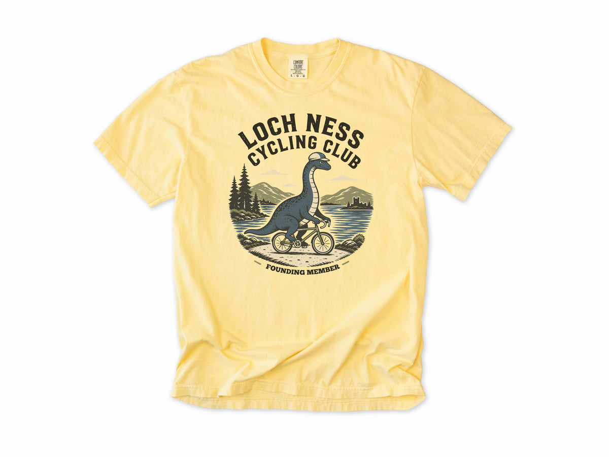 Cycling T-shirt in Butter, 'Loch Ness Cycling Club', a monster riding a bike by a loch, for cycling club members