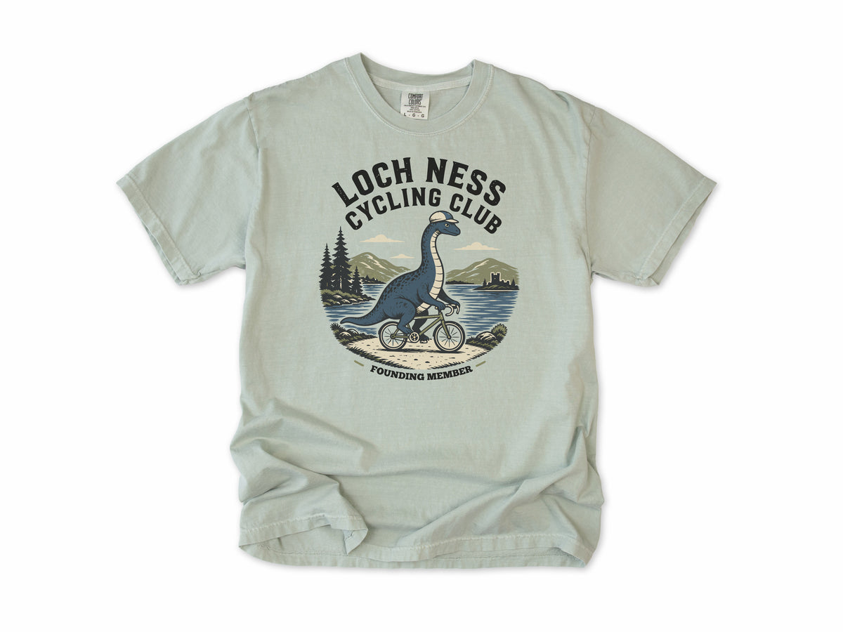 Cycling T-shirt in Bay, 'Loch Ness Cycling Club', a monster riding a bike by a loch, for cycling club members
