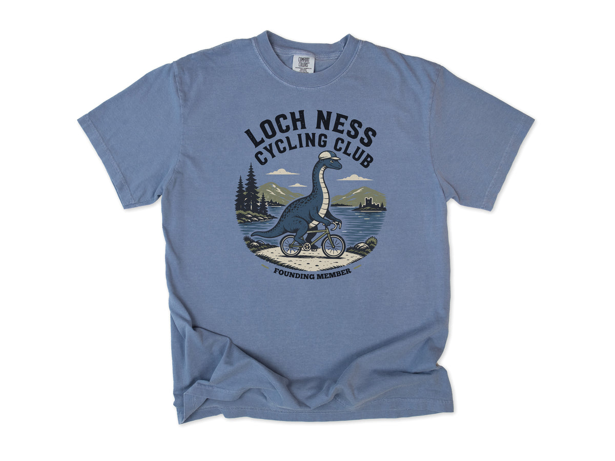 Cycling T-shirt in Blue Jean, 'Loch Ness Cycling Club', a monster riding a bike by a loch, for cycling club members
