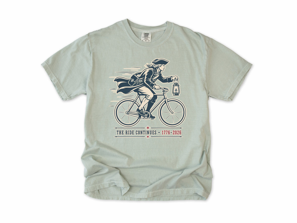 Cycling T-shirt in Bay, Midnight Ride: a colonial rider with a lantern on a bike, America 250 and 4th of July gift for cyclists