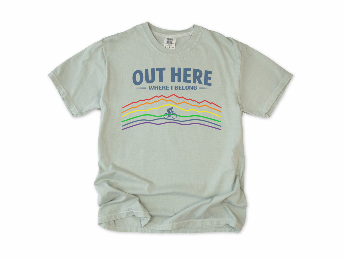 Cycling T-shirt in Bay, 'Out Here Where I Belong' with rainbow mountain lines and a cyclist, for outdoor cyclists