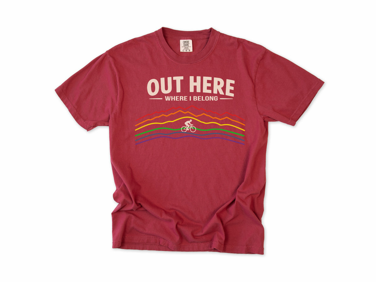 Cycling T-shirt in Chili, 'Out Here Where I Belong' with rainbow mountain lines and a cyclist, for outdoor cyclists