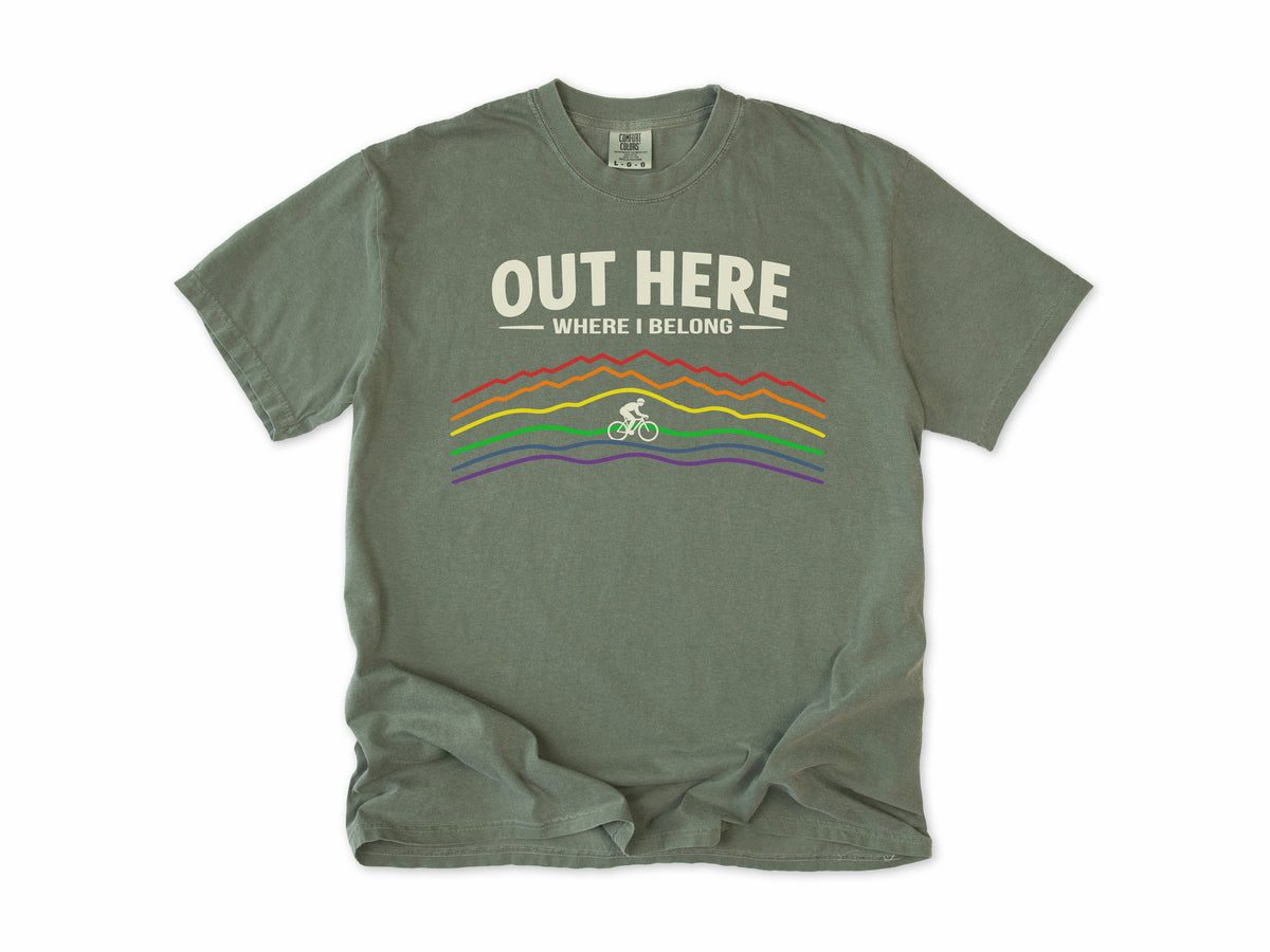 Cycling T-shirt in Moss, 'Out Here Where I Belong' with rainbow mountain lines and a cyclist, for outdoor cyclists