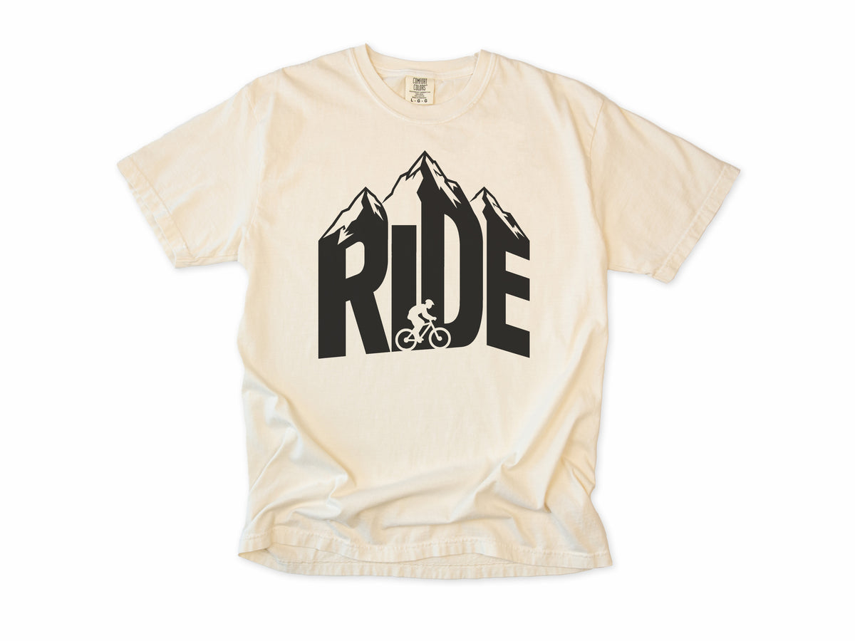 Cycling T-shirt in Ivory, 'RIDE' in mountain-shaped letters with a cyclist, for mountain bikers